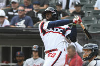 Chicago White Sox's Luis Robert hits a home run during the first inning of a baseball game against the Detroit Tigers, Sunday, Oct. 3, 2021, in Chicago. (AP Photo/Matt Marton)