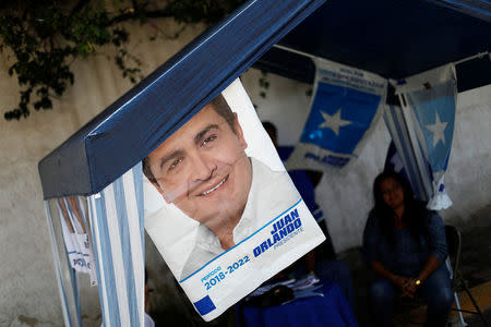 Electoral advertising of Honduras President and National Party candidate Juan Orlando Hernandez is seen ahead of the November 26 presidential election in Tegucigalpa, Honduras, November 24, 2017. REUTERS/Edgard Garrido