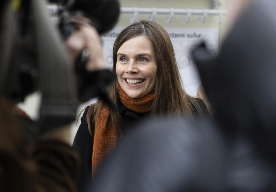 Iceland's Prime Minister Katrin Jakobsdottir speaks to the media after voting at a polling station in Reykjavik, Iceland, Saturday, Sept. 25, 2021. Icelanders are voting in a general election dominated by climate change, with an unprecedented number of political parties likely to win parliamentary seats. (AP Photo/Arni Torfason)