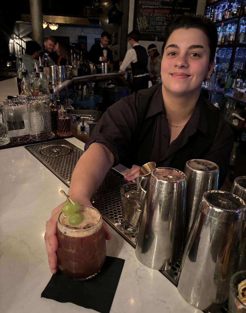 Penka Heusinkveld, a bartender at The Blind Elephant, serves a cocktail on Jan. 19. 2024.