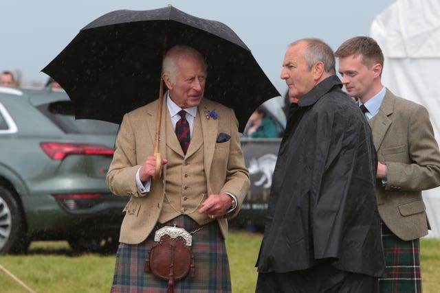 The King holding an umbrella at Mey Highland Games