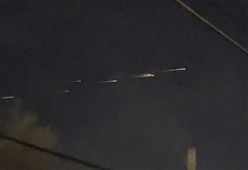 This image from video provided by Jaime Hernandez shows streaks of light travelling across the sky over the Sacramento, Calif., area on Friday night, March 17, 2023. "Mainly, we were in shock, but amazed that we got to witness it," Hernandez said. "None of us had ever seen anything like it." (Jaime Hernandez via AP)