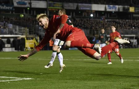 Football Soccer Britain - Plymouth Argyle v Liverpool - FA Cup Third Round Replay - Home Park - 18/1/17 Plymouth Argyle's Yann Songo'o fouls Liverpool's Alberto Moreno resulting in a penalty Reuters / Dylan Martinez Livepic