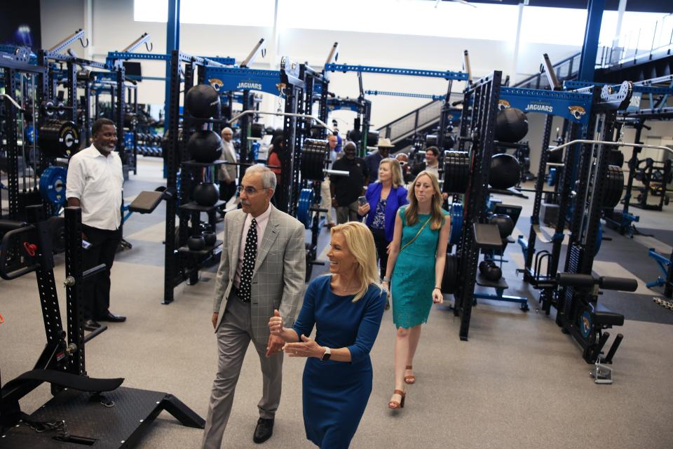 Jacksonville Mayor Donna Deegan and city councilman Ron Salem get a tour of the Jaguars weight room at the Miller Electric Center after its grand opening on Tuesday.