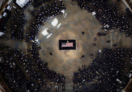 Cindy McCain, wife of the late U.S. Senator John McCain, stands over his casket as he lies in state in the U.S. Capitol Rotunda, Washington August 31, 2018. Morry Gash/Pool via REUTERS