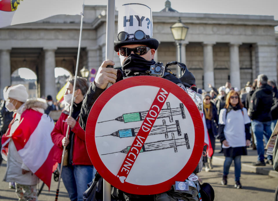 FILE - A man takes part in a demonstration against the country's coronavirus restrictions in Vienna, Austria, Nov. 20, 2021. Austria's parliament is due to vote Thursday, Jan. 20, 2022, on plans to introduce a COVID-19 vaccine mandate for the adult population, the first of its kind in Europe. (AP Photo/Lisa Leutner, File)