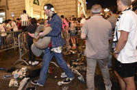 <p>Juventus’ fans run away from San Carlo Square following panic created by the explosion of firecrackers as they was watching the match on a giant screen on June 3, 2017. (Giorgio Perottino/Reuters) </p>