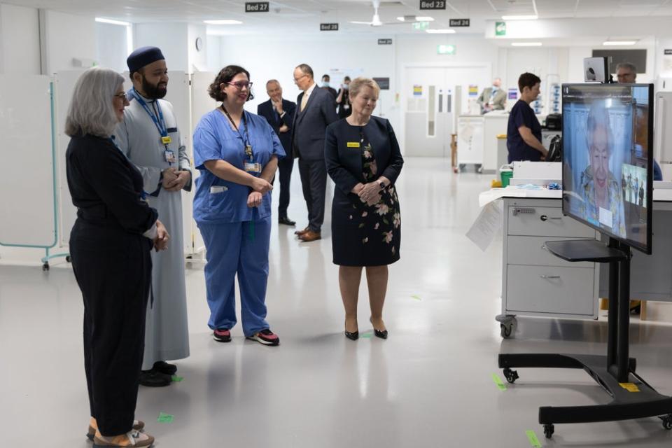 Queen Elizabeth II speaking to staff during a virtual visit to the Royal London Hospital to mark the official opening of the hospital's Queen Elizabeth Unit (PA)