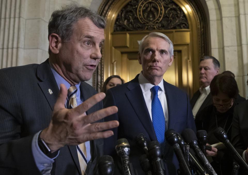 Sen. Sherrod Brown, D-Ohio, left, and Sen. Rob Portman, R-Ohio, speak to reporters in Washington in 2018.