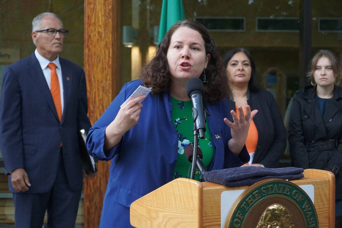State Rep. Sharon Shewmake, D-42nd, speaks alongside Gov. Jay Inslee, Friday, Oct. 21, at Western Washington University in Bellingham. The governor announced new legislative measures to assure abortion access in the state’s constitution.