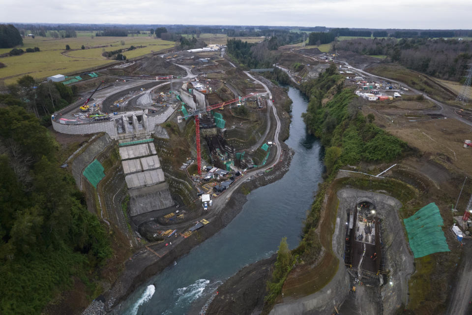 An aerial view shows the the Pilmaiquen River flanked on both banks by a hydroelectric plant construction site owned by the Norwegian company Statkraft in southern Chile, on Monday, June 27, 2022. Many Mapuche communities near the the Pilmaiquen, the Truful Truful River and elsewhere in the country's water-rich south are fighting against hydroelectric plants that they see as desecrating nature and depriving Indigenous communities of essential energies that keep them from getting sick. (AP Photo/Rodrigo Abd)