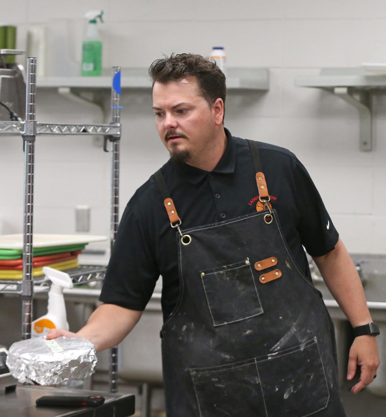 SJ Houston leads his class on a lesson in cake icing, Tuesday, April 16, 2024, at Lafayette Jeff High School in Lafayette, Ind.