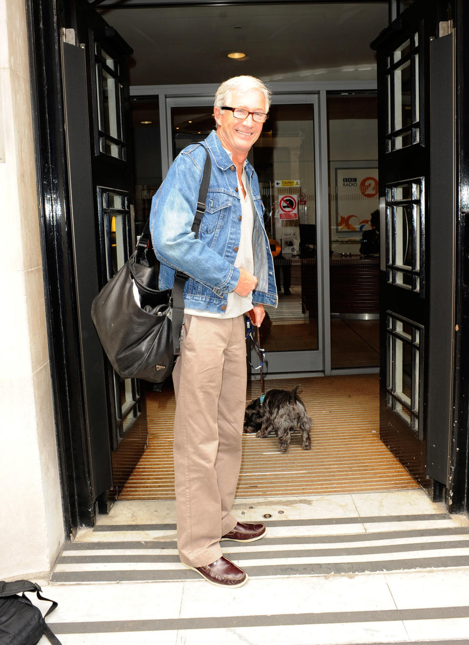 Paul O'Grady with his dog Olga outside the BBC Radio One studios London, England - 19.08.10