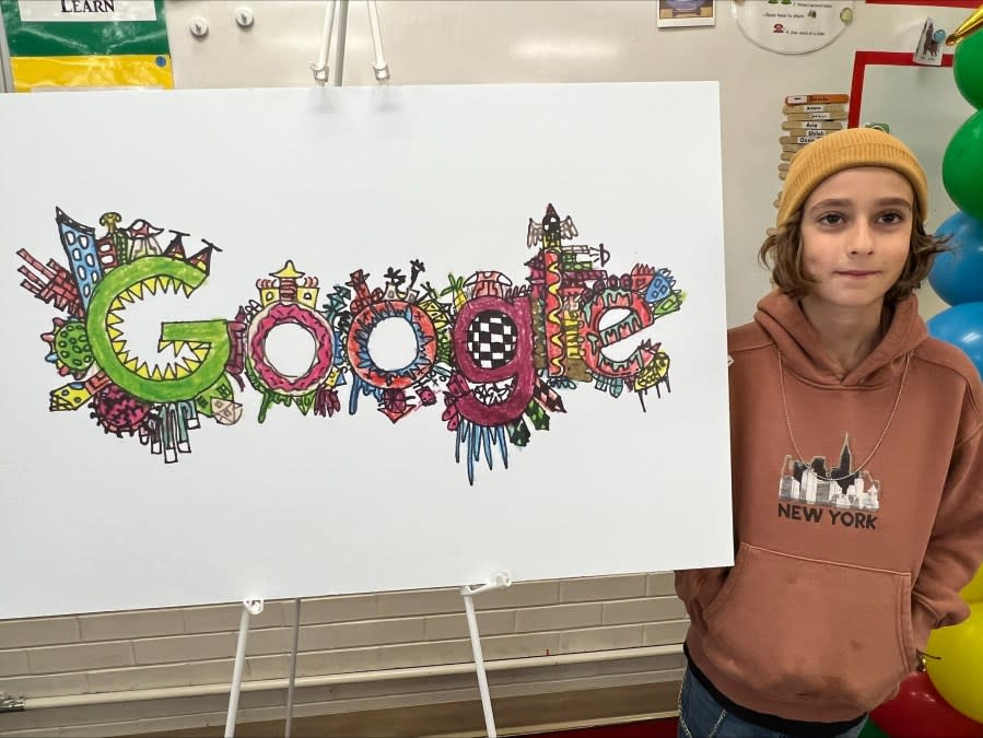Gibran Nahle, a third grader in the Salt Lake City School District, stands by his Doodle for Google art piece (Courtesy: Salt Lake City School District)