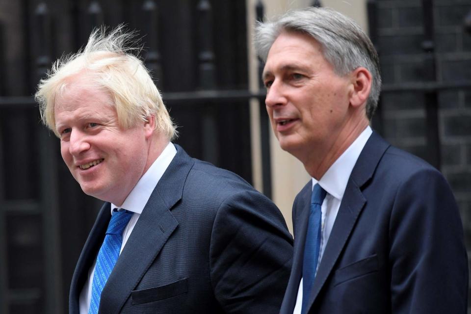 Boris Johnson and Philip Hammond have differing stances on No Deal Brexit (REUTERS)