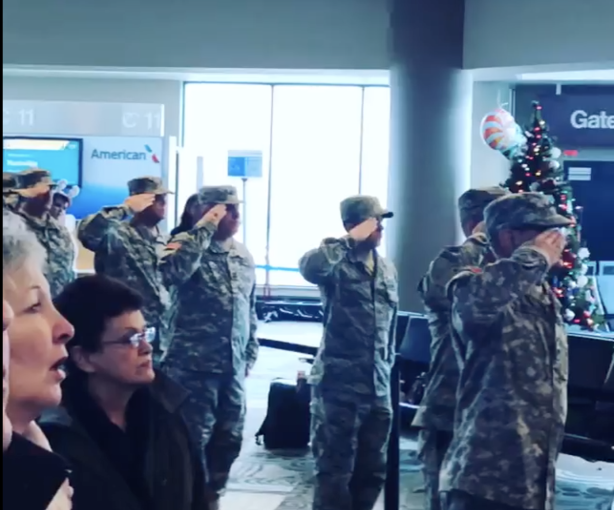 Military members during the national anthem sung at the Nashville airport. (Photo: Facebook)