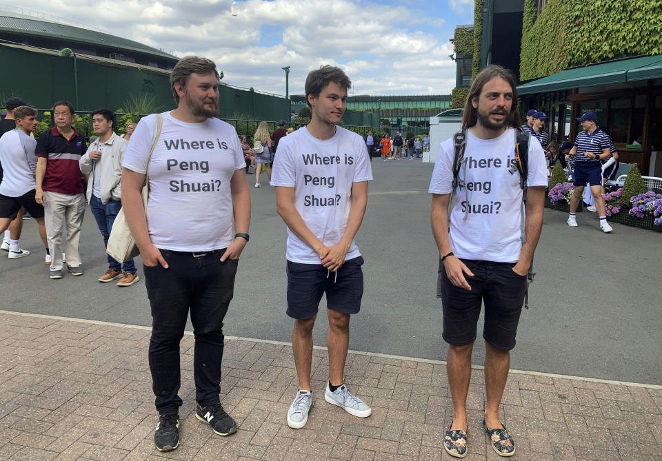 From left Protesters Will Hoyles, 39, Caleb Compton, 27, and Jason Leith, 34, who all work for Free Tibet pose for the media in T-shirts reading 