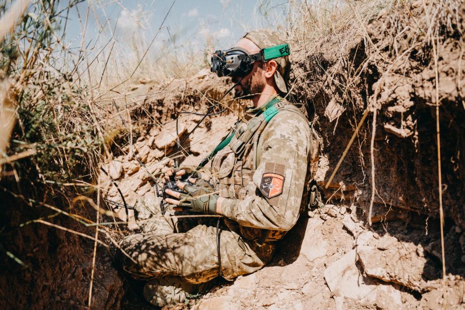 A Ukrainian drone operator from the 24th Separate Mechanized Brigade tests new military equipment, including FPV drones, in a training area amid the Russia-Ukraine war in Donetsk Oblast, Ukraine, August 3, 2023. (Photo by Wojciech Grzedzinski/Anadolu Agency via Getty Images)