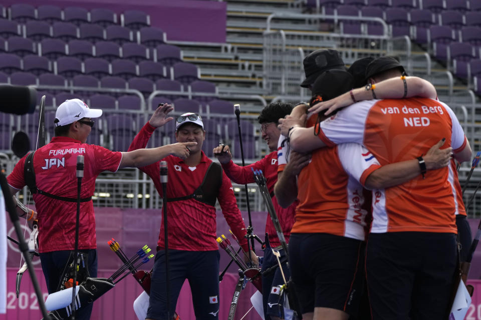 Japan's team celebrate at the end of the men's team bronze medal match against the Netherlands at the 2020 Summer Olympics, Monday, July 26, 2021, in Tokyo, Japan. (AP Photo/Alessandra Tarantino)