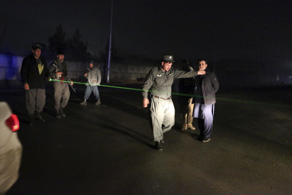 Security forces block the roads at the site of a suicide bomber attack in Kabul, Afghanistan, Wednesday, Nov. 28, 2018. Najib Danish, spokesman for Afghanistan's Interior Ministry, said the attack in Kabul took place when a suicide bomber detonated his explosives and then other insurgents started a gun battle with forces in the area. (AP Photo/Rahmat Gul)