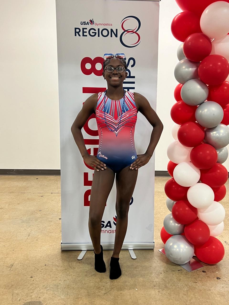 Brianna Pittman, 12, of Gray, posing for a photo at the 2024 USA Gymnastics Region 8 Xcel Regional Championships in South Carolina, May 3.