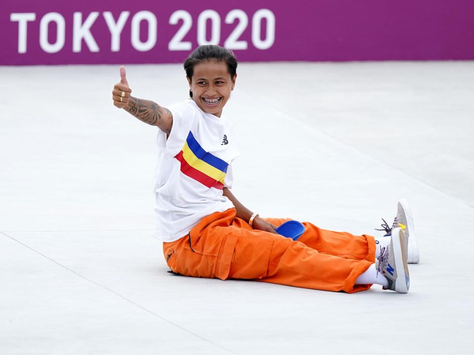 Margielyn Didal gives a thumbs-up from the ground during the Tokyo Olympics.