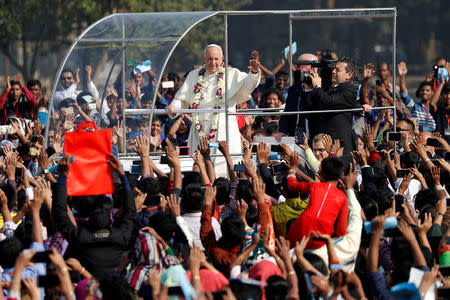 Pope Francis greets believers as he arrives for a mass in Dhaka, Bangladesh December 1, 2017. REUTERS/Damir Sagolj