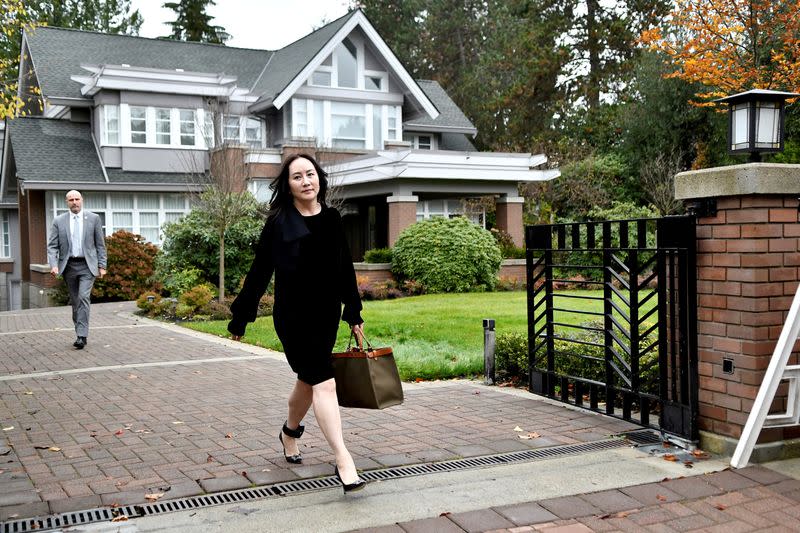 FILE PHOTO: Huawei Technologies Chief Financial Officer Meng Wanzhou leaves her home to attend a court hearing in Vancouver