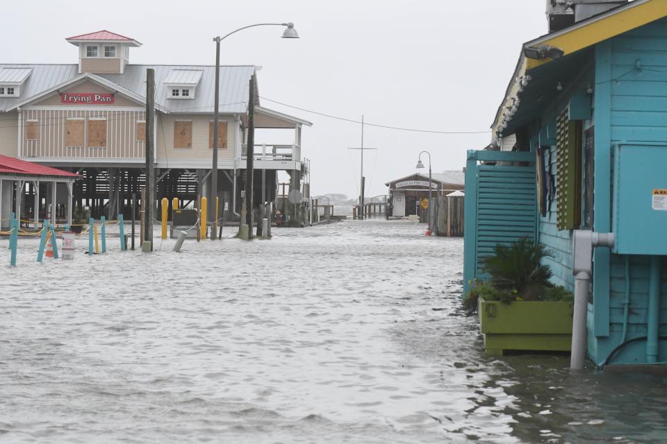 Yacht Basin Drive in Southport is flooded during a high-tide event in September 2019.