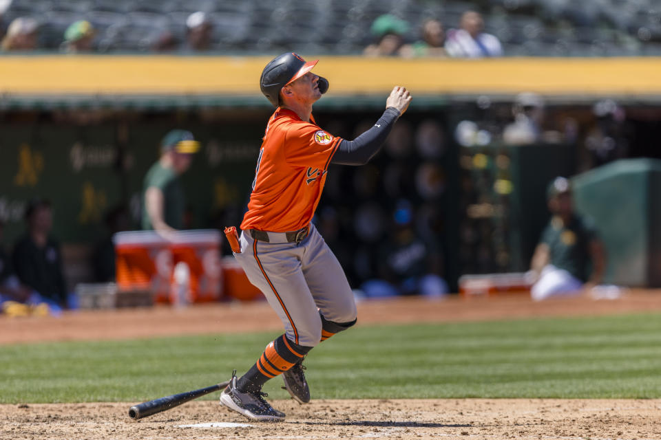 Baltimore Orioles' Austin Hays hits a sacrifice fly for an RBI against the Oakland Athletics during the fourth inning of a baseball game Saturday, July 6, 2024, in Oakland, Calif. (AP Photo/John Hefti)