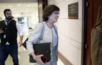 Sen. Susan Collins, R-Maine, center, walks on Capitol Hill, Monday, Sept. 24, 2018 in Washington. Denouncing his accusers for launching "smears, pure and simple," Brett Kavanaugh said Monday he'll continue fighting for Senate confirmation to the Supreme Court, even as Republicans battled to prevent a second woman's assertion of a long-ago sexual assault from derailing his nomination. (AP Photo/Alex Brandon)