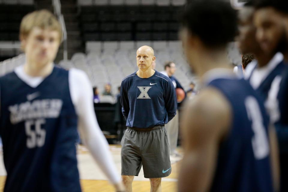 Chris Mack led Xavier to the Elite Eight in 2017. In nine seasons with the Musketeers, he won more games than any coach in school history (215) and led Xavier to the NCAA Tournament eight times.