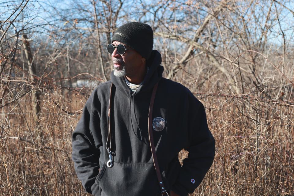 Gervis Myles, a former Wisconsin conservation warden who left after years of issues within the conservation warden program, enjoys Estabrook Dog Park with his dog The Mighty Mikey, on Dec 12, 2023.