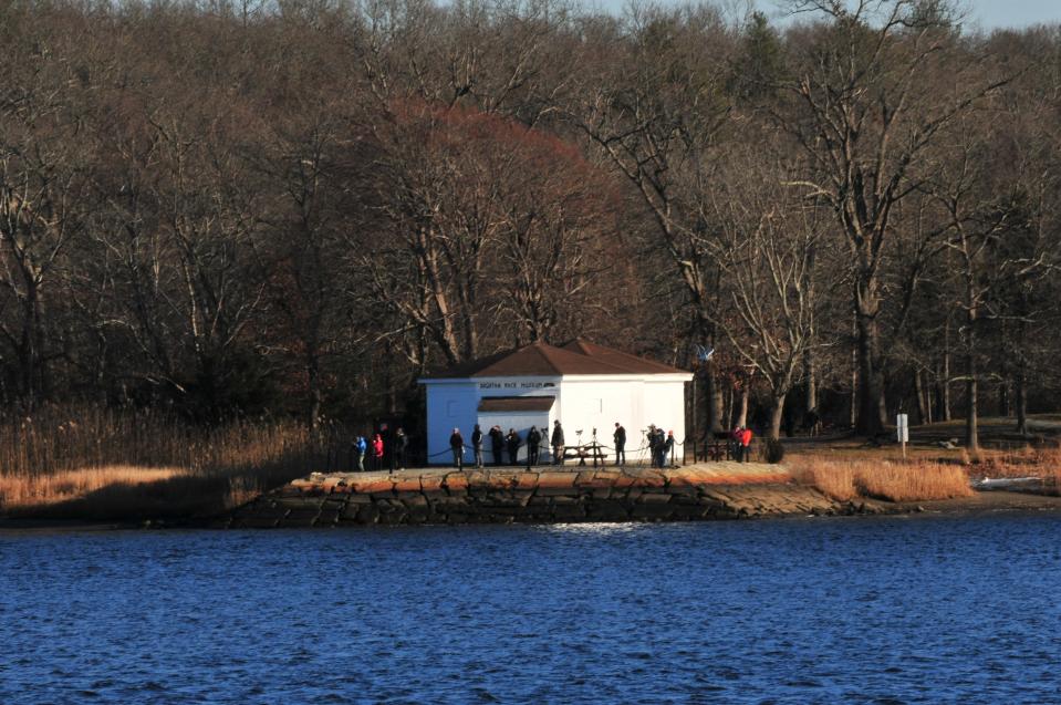 Birders stake out the Taunton River from Dighton Rock State Park for a glimpse of a rare Steller's Sea Eagle on Monday, Dec. 20, 2021.