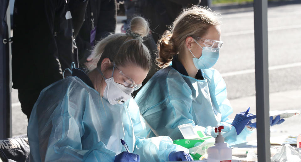 Covid-19 testing is conducted in Broadmeadows, Melbourne, Sunday, June 28, 2020. Victoria has set up virus testing stations in neighbourhoods as it battles community transmission. (AAP Image/David Crosling) NO ARCHIVING