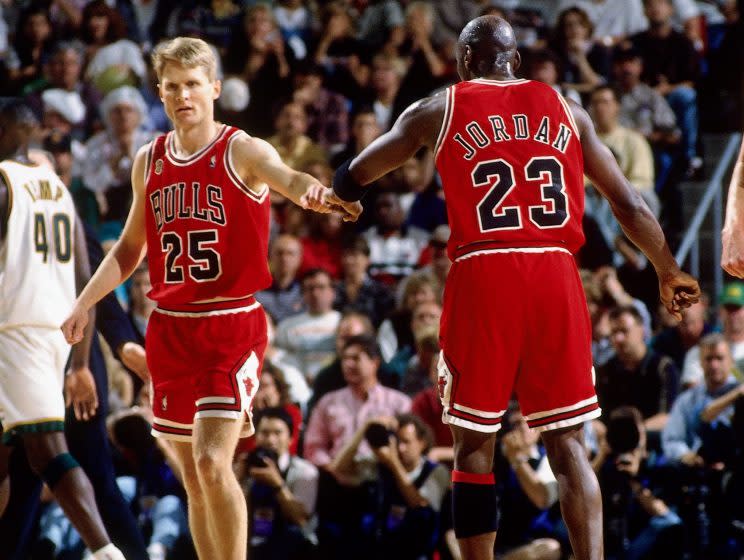 Michael Jordan high fives teammate Steve Kerr during Game 3 of the 1996 NBA Finals. (Getty)