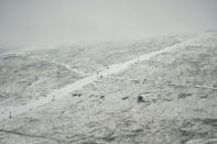 Fresh snow covers the Afriski ski resort near Butha-Buthe, Lesotho, Saturday July 30, 2022. While millions across Europe sweat through a summer of record-breaking heat, Afriski in the Maluti Mountains is Africa's only operating ski resort south of the equator. It draws people from neighboring South Africa and further afield by offering a unique experience to go skiing in southern Africa. (AP Photo/Jerome Delay)