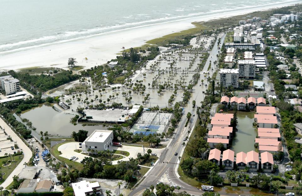 Siesta Key Beach parking lot was still underwater Friday afternoon after Hurricane Helene's storm surge.