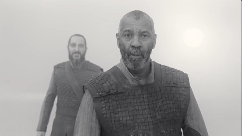 Denzel Washington as Lord Macbeth in The Tragedy of Macbeth stares at camera in black and white still