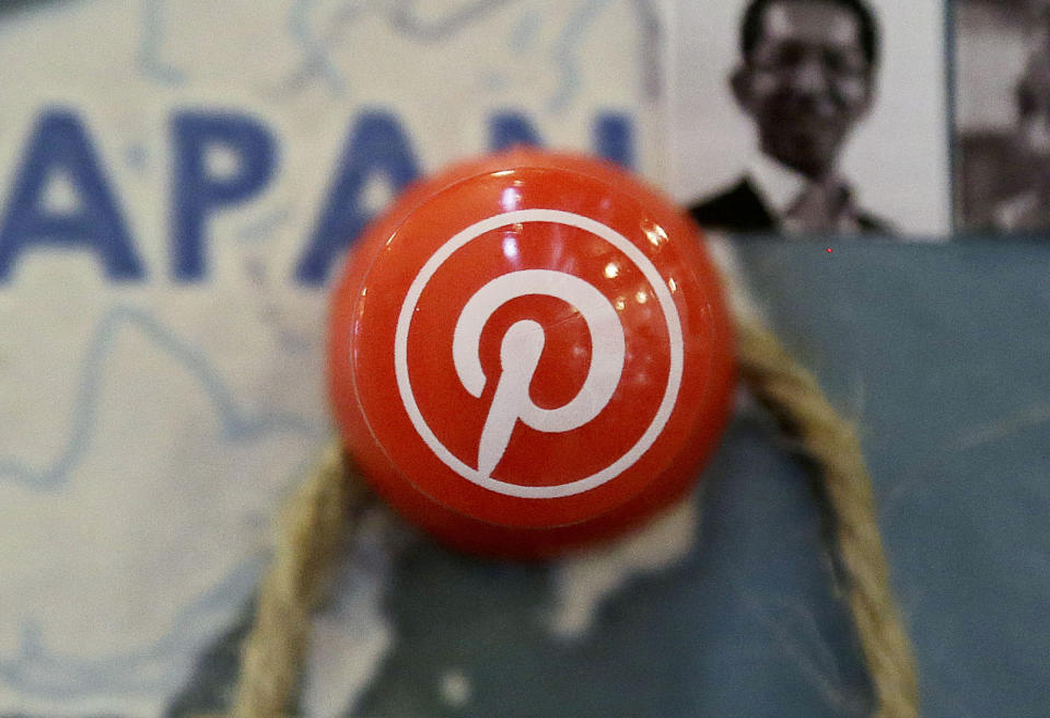 FILE - A pin signifies Pinterest's Japan offices on a map, April 1, 2015, at the Pinterest office in San Francisco. Two Pinterest directors resigned from Nextdoor's board of directors earlier this month, the U.S. Justice Department said Wednesday, Aug. 16, 2023, amid the agency's broader efforts to enforce antitrust law aimed at barring executives from holding similar positions at rival companies. (AP Photo/Jeff Chiu, File)