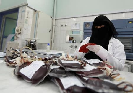 An employee registers bags of blood at a blood transfusion centre in Sanaa, Yemen August 7, 2017. REUTERS/Khaled Abdullah