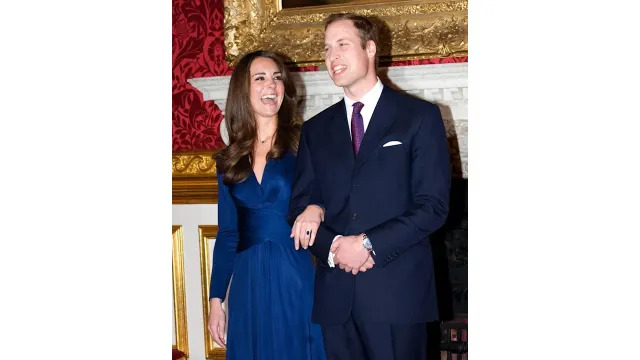 Prince William and Kate Middleton laughing as they pose for engagement photographs in St James's Palace on 16 November 2010 