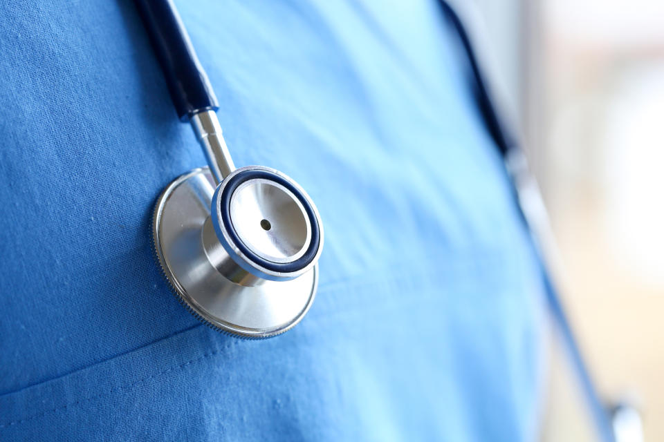 A black doctor has shared a powerful message urging people to treat him the same if he is wearing his scrubs or a hoodie. (Getty Images)