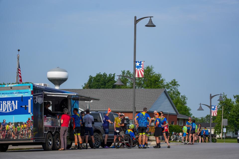 Riders stop in Slater during the RAGBRAI route inspection ride, Wednesday, June 7, 2023. 