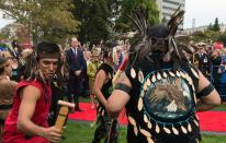 Prince William watches First Nations traditional dancers in front of the Legislative Assembly in Victoria, British Columbia, Canada