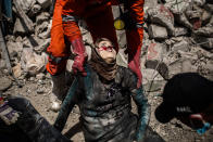 <p>A civil defense team holds the dead body of an Iraqi woman killed after a female suicide bomber blows herself up in Mosul, just a few meters far away from Al Noor Mosque. West Mosul. Iraq. July 2, 2017. (Photograph by Diego Ibarra Sánchez / MeMo) </p>