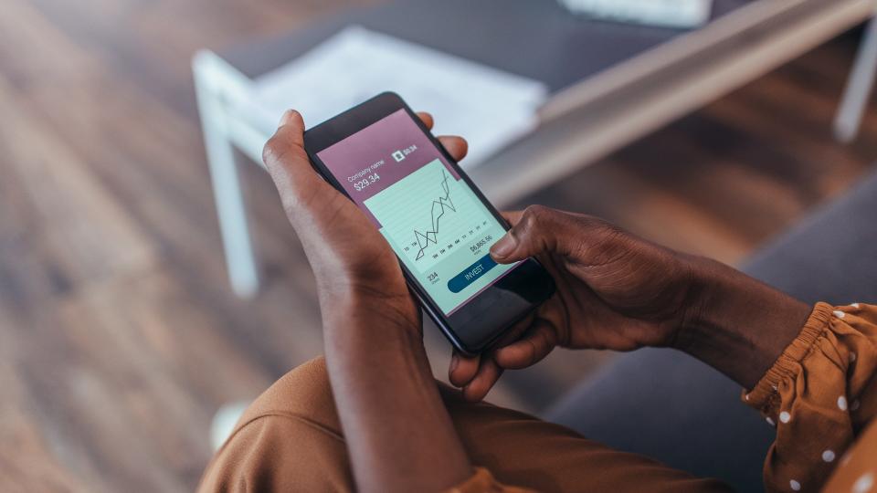 Close up of women's hands holding smartphone.