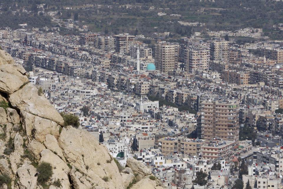 FILE - This March 22, 2012 file photo shows general view of Damascus, Syria. Syrian state TV said Monday, March 20, 2017 that government forces have regained control of parts of Damascus that were attacked and captured by rebels and militants the previous day. (AP Photo/Muzaffar Salman, File)