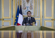 FILE - In this April 22, 2021 file photo, French President Emmanuel Macron attends a Climate Summit video conference, at the Elysee Palace, in Paris,With a year to go to the presidential vote, French President Emmanuel Macron is getting ready for a potential re-election bid by prioritizing reviving the economy and saving jobs. The country is slowly stepping out of its partial lockdown. Macron’s ability to meet the challenge will be key _ as France is among countries worst hit by the pandemic in the world, with over 105,000 virus-related deaths. (Ian Langsdon/ Pool photo via AP, File)