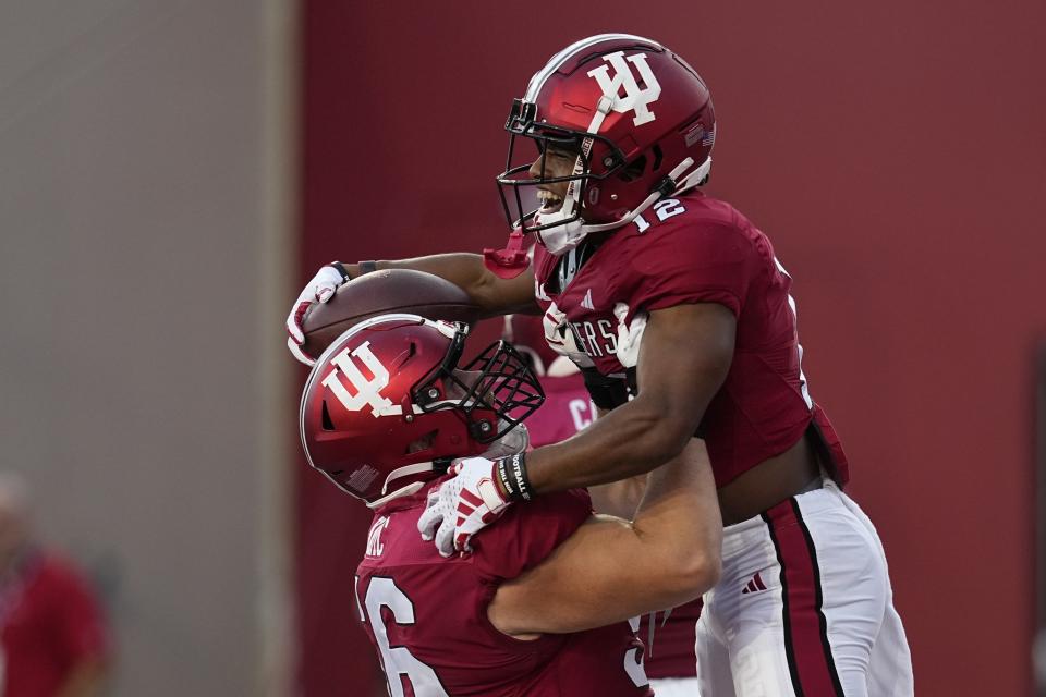 Indiana running back Jaylin Lucas, right, celebrates a touchdown against Indiana State with Mike Katic during the first half of an NCAA college football game Friday, Sept. 8, 2023, in Bloomington, Ind. (AP Photo/Darron Cummings)